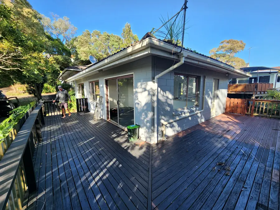 Before: an old dark weathered deck